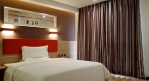 7 Days Premium Tangshan Railway Station Jiaotong University客房内的一张或多张床位