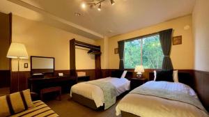 Кровать или кровати в номере HAKUBA Moegi HOTEL +86 фотографий