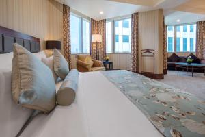 Postel nebo postele na pokoji v ubytování Wuhan Jin Jiang International Hotel
