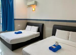 Postel nebo postele na pokoji v ubytování Burmahtel Hotel + 225 fotografií