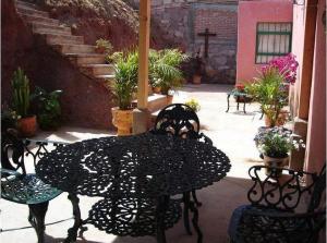 a black table and chairs on a patio at Manzano B&B in Guanajuato
