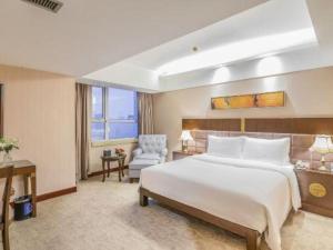 Ένα ή περισσότερα κρεβάτια σε δωμάτιο στο YUN-RAY Ambassador Hotel +264 φωτογραφίες