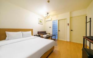 Letto o letti in una camera di Yongin Valentine