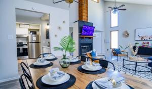 a dining room and living room with a table and chairs at Coffee Bar | Fast Wifi | 5 miles to Schlitterbahn in Schumannsville