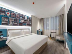 Katil atau katil-katil dalam bilik di 7 Days Inn Baoding Railway Station