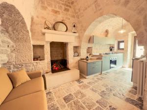 Kuchyň nebo kuchyňský kout v ubytování Profumi del Melograno Trulli Resort