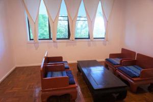 a room with two chairs and a table and windows at Amaravati Wellness Center in Ban Muang Pha +254 photos