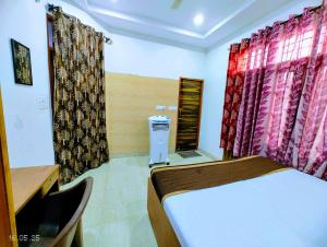 Hotel Yolo- Chandigarh客房内的一张或多张床位