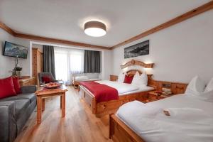Postel nebo postele na pokoji v ubytování Hotel Hubertushof