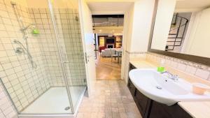 a bathroom with a shower and a sink at 6 guests apt with terrace in pedestrian historic centre of Spoleto in Spoleto +68 photos