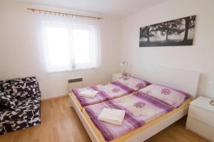 Postel nebo postele na pokoji v ubytování Resort Zajíci ze Zaječí