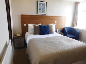 Postel nebo postele na pokoji v ubytování Cullen Bay Hotel