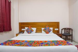 Postel nebo postele na pokoji v ubytování FabHotel De Gold Karol Bagh + 24 fotografií