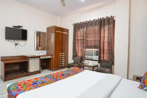 Postel nebo postele na pokoji v ubytování FabHotel De Gold Karol Bagh