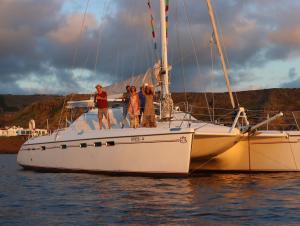 a group of people standing on a sailboat in the water at ALL ONE Catamaran in Ponta Delgada +16 photos
