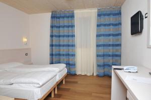 Posteľ alebo postele v izbe v ubytovaní Bio Hotel Benny