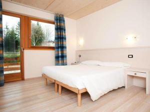 Posteľ alebo postele v izbe v ubytovaní Bio Hotel Benny