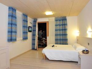 Posteľ alebo postele v izbe v ubytovaní Bio Hotel Benny