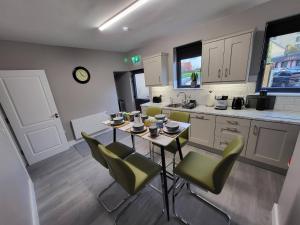 a kitchen with a table and chairs and a counter at Old Market Street in Sligo