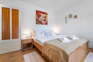 Postel nebo postele na pokoji v ubytování Apartments Katarina