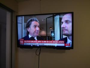 TV a/nebo společenská místnost v ubytování Residence Arco delle Rose