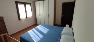 Ένα ή περισσότερα κρεβάτια σε δωμάτιο στο Casa Leonardo close to the beach