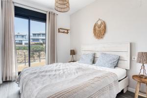 a bedroom with a bed and a large window at Izabell in Finestrat +23 photos