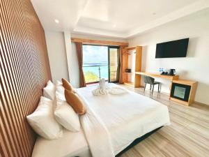 Televiisor ja/või meelelahutuskeskus majutusasutuses AIMI Beach Hotel