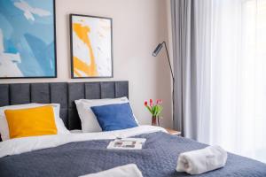 Posteľ alebo postele v izbe v ubytovaní IND.U Apartamenty