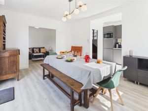 a kitchen and dining room with a table and chairs at - COLETTE- Havre de paix a Pouldohan in Trégunc