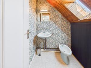 a bathroom with a sink and a toilet at - COLETTE- Havre de paix a Pouldohan in Trégunc +23 photos