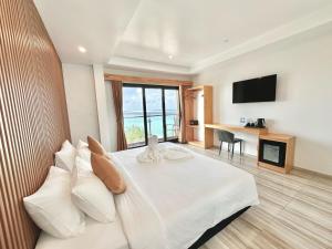 Voodi või voodid majutusasutuse AIMI Beach Hotel toas