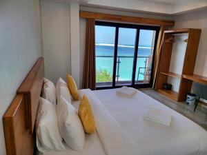 Voodi või voodid majutusasutuse AIMI Beach Hotel toas