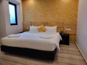 Voodi või voodid majutusasutuse AIMI Beach Hotel toas