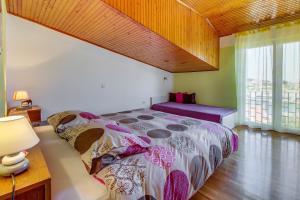 Postel nebo postele na pokoji v ubytování Apartments Petra