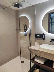 a bathroom with a sink and a mirror at Royal Antibes - Luxury Hotel, Résidence, Beach & Spa in Antibes