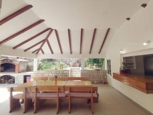 a dining room with a table and a tv at Villa Lovor in Zaton