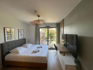 Posteľ alebo postele v izbe v ubytovaní Les Loges de la Mer - Pérols