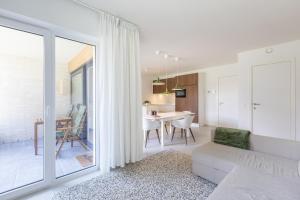 a living room with a couch and a table at LECOMTE - The Shoreline Green 153 in Ostend