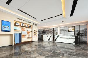 a large room with photographs on the walls and a lobby at Atour X Hotel Chengdu Jinhua Wanda Zhonggang Plaza in Chengdu