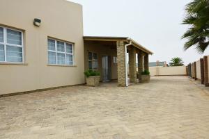 a house with a driveway in front of it at 1801 on Brandberg in Hentiesbaai