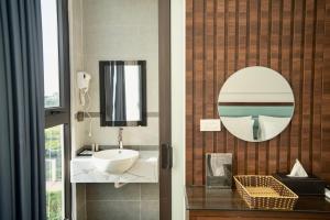 a bathroom with a sink and a mirror at Royal Boutique Hotel in Ða Phúc +23 photos