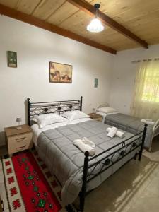 Postel nebo postele na pokoji v ubytování Villa KRONI