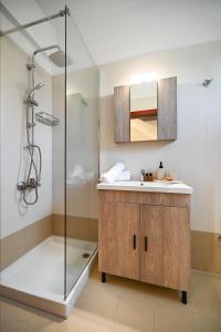 a bathroom with a sink and a shower at Depis home, in Lefkas town in Lefkada Town
