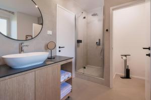 a bathroom with a sink and a shower at Villa Sarizol in Rovinj +14 photos