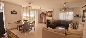 a living room with a couch and a table at Villa Martina in Cambrils