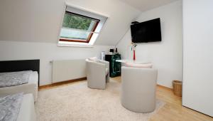 TV a/nebo společenská místnost v ubytování Zimmer u Apartment in Bad Gams Deutschlandsberg