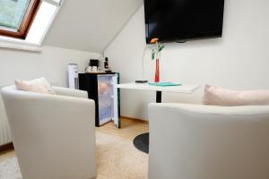 TV a/nebo společenská místnost v ubytování Zimmer u Apartment in Bad Gams Deutschlandsberg