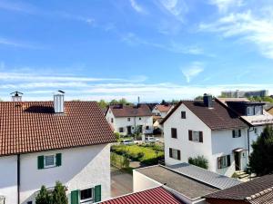 a view of roofs of houses in a town at Ferienwohnung Seehas am Bodensee in Friedrichshafen