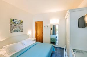 Postel nebo postele na pokoji v ubytování Hotel Cava Dell'Isola + 37 fotografií